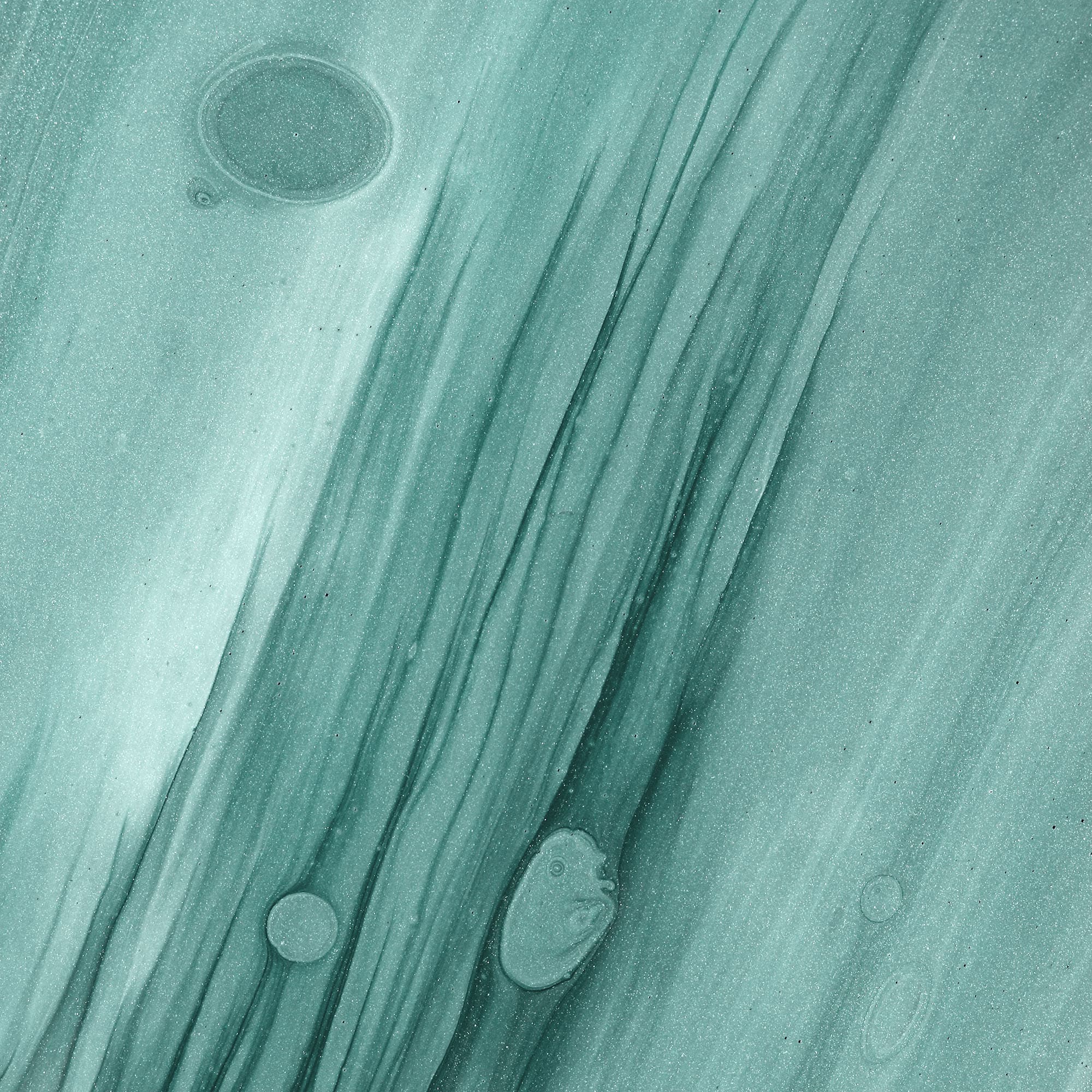 A teal abstract pattern with flowing lines and scattered bubble-like shapes. 