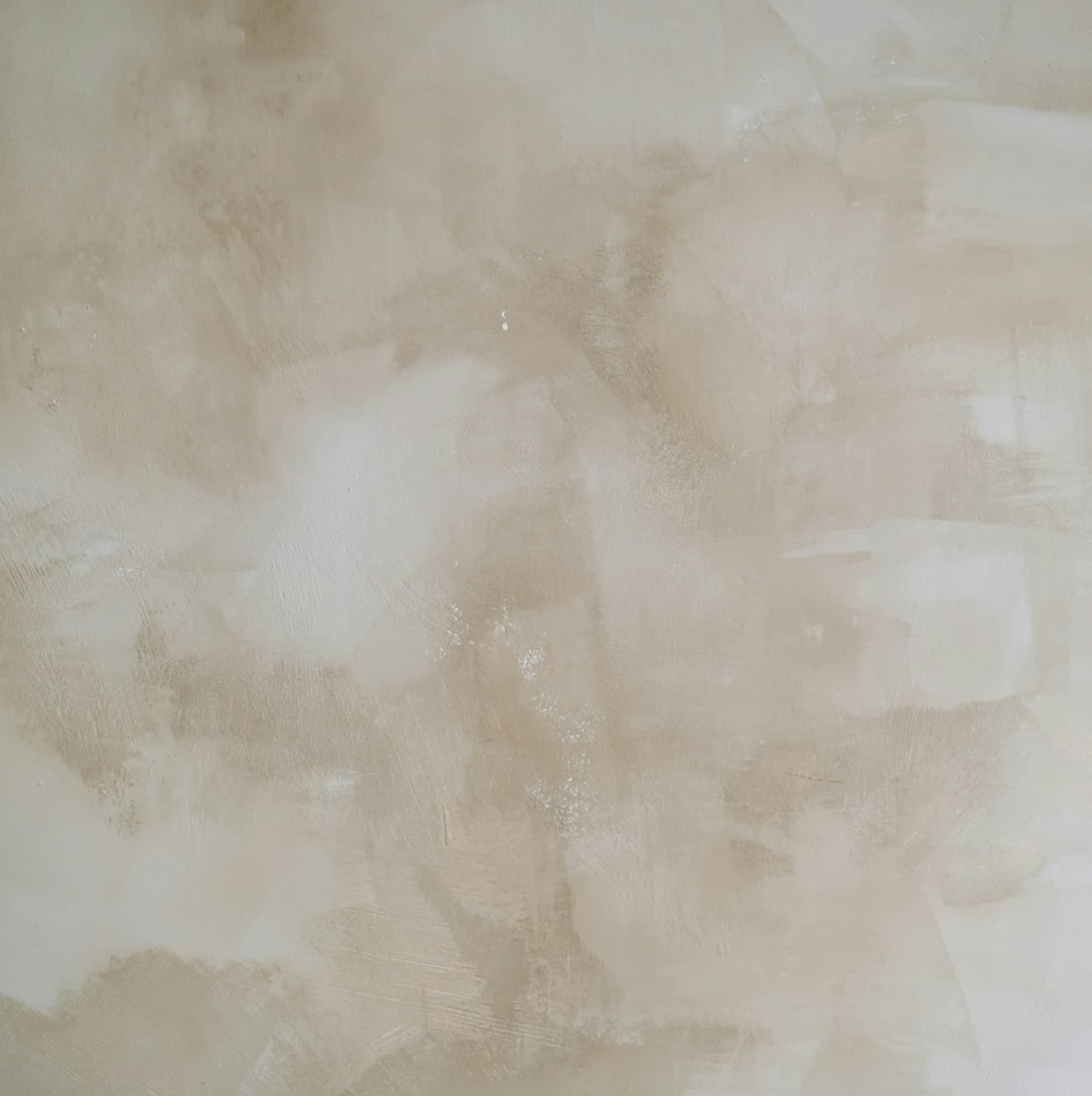 White and beige colored paint strokes making a textured surface.